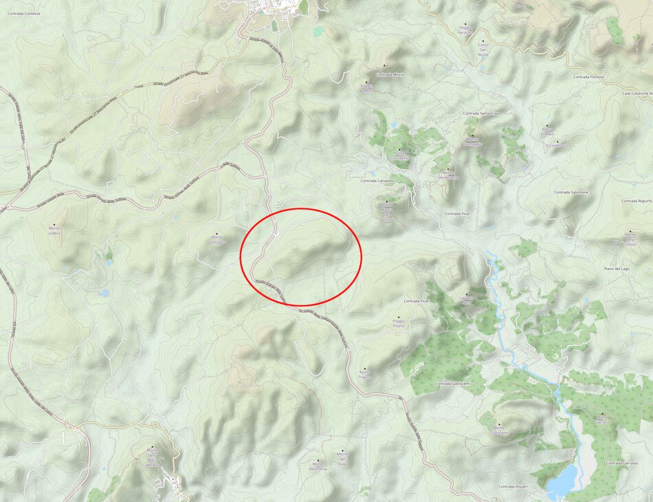 Topographic map showcasing elevation, roads, and bodies of water in a hilly region.